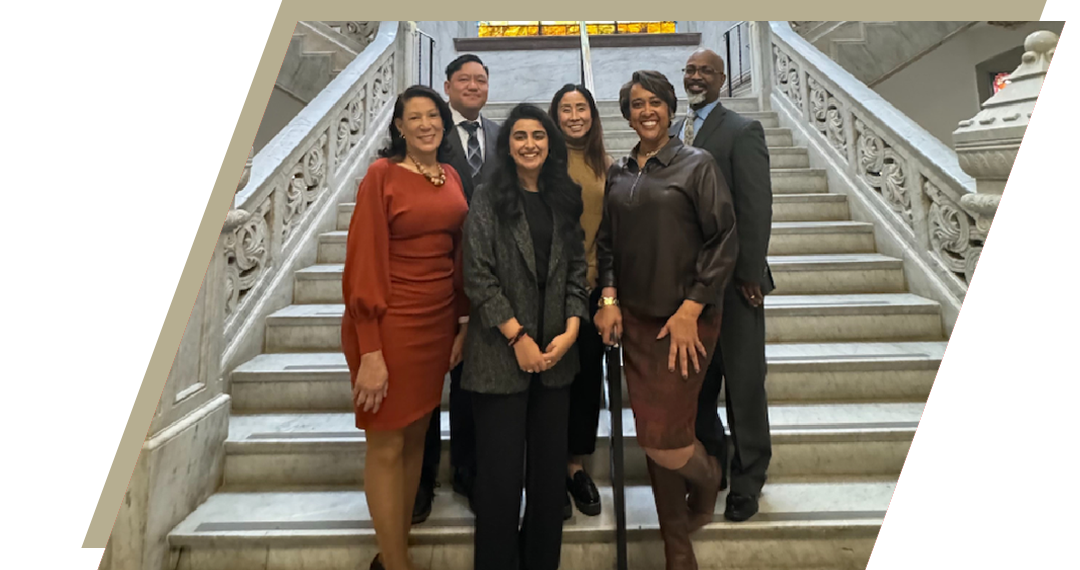 Wendy Ellis with a group of people standing on a staircase.