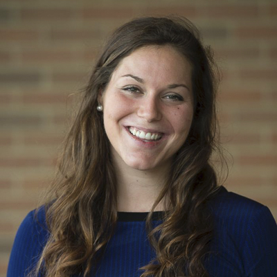 kristen hayes a person with long brown hair in a navy shirt
